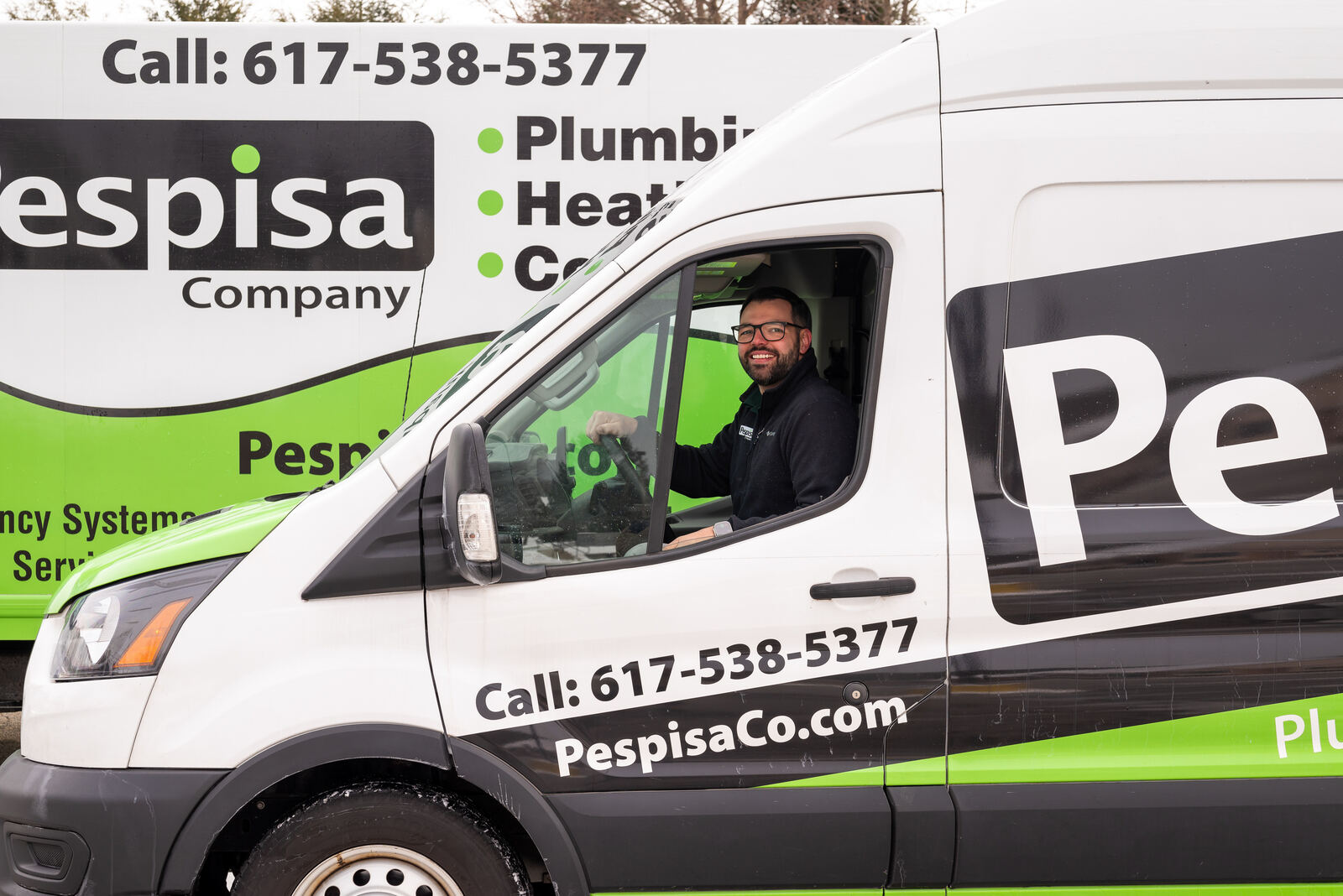A Pespisa Company technician at the wheel of a branded service van