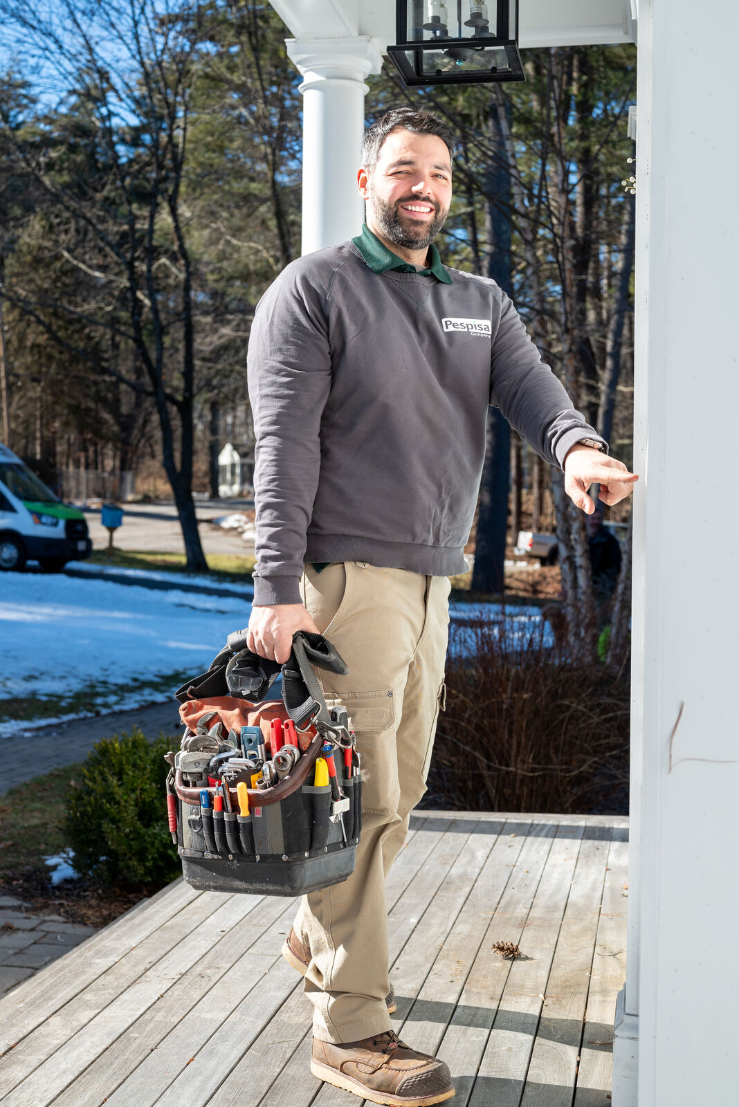 A Pespisa technician shaking hands with a Chelmsford homeowner